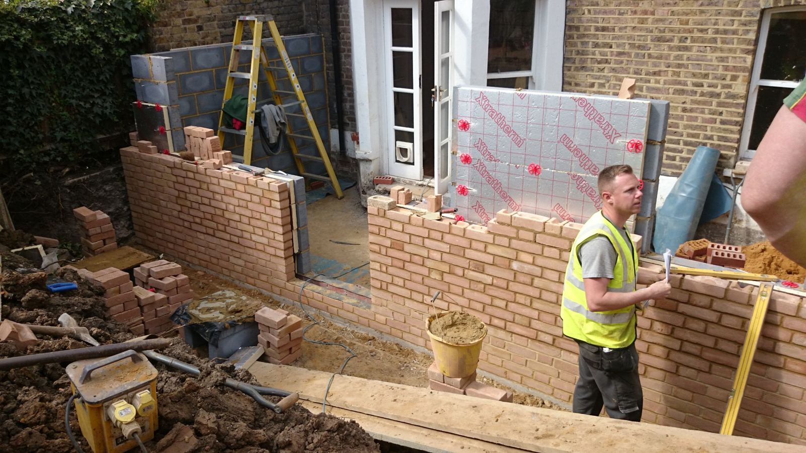 Rear extension in facing brick with insulated cavity, under construction